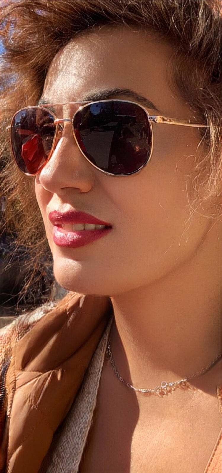 Victoria Eugénie Zagouris (Victoria E. Burton) - Cultural Collaborator, Artist, Author & Creator of The Cozy Adventurer Portrait of Victoria Eugénie Zagouris, cultural collaborator, artist, author and creator of The Cozy Adventurer, wearing aviator style sunglasses.